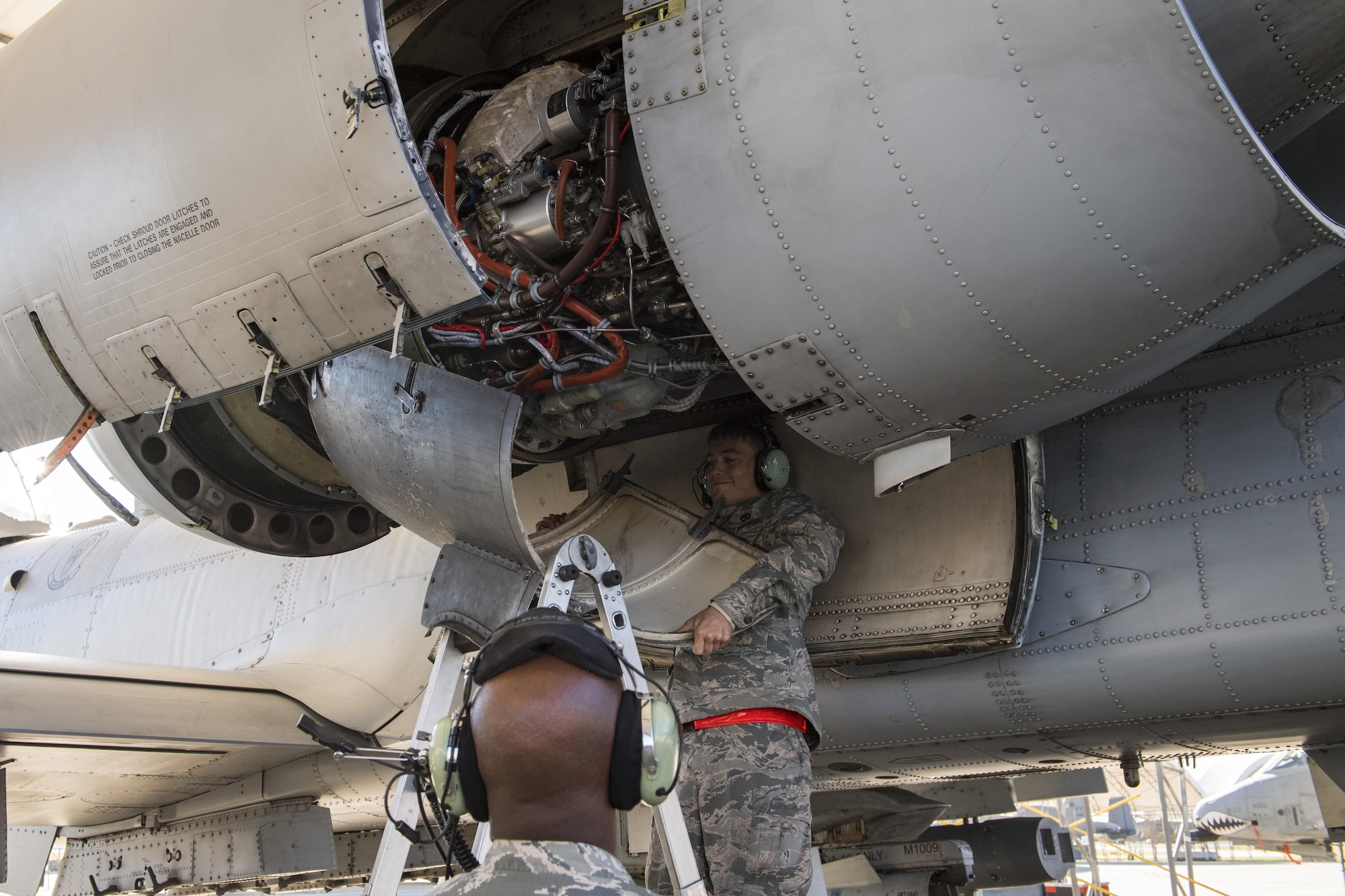 Airman 1st Class William Osborne, 23d Aircraft Maintenance Squadron, replaces the protective covering on the engine of an A-10C Thunderbolt II, Oct. 31, 2017, at Moody Air Force Base, Ga. Pilots, traveled to Eglin AFB, Fla., to participate in exercise COMBAT HAMMER. The exercise evaluates the effectiveness, maintainability, suitability and accuracy of precision guided munitions and high technology air to ground munitions from tactical deliveries against realistic targets with realistic enemy defenses. Moody’s team will be assessed and trained on how accurately and quickly a munition is built, loaded onto the aircraft and dropped from the aircraft onto a target. (U.S. Air Force photo by Senior Airman Janiqua P. Robinson)