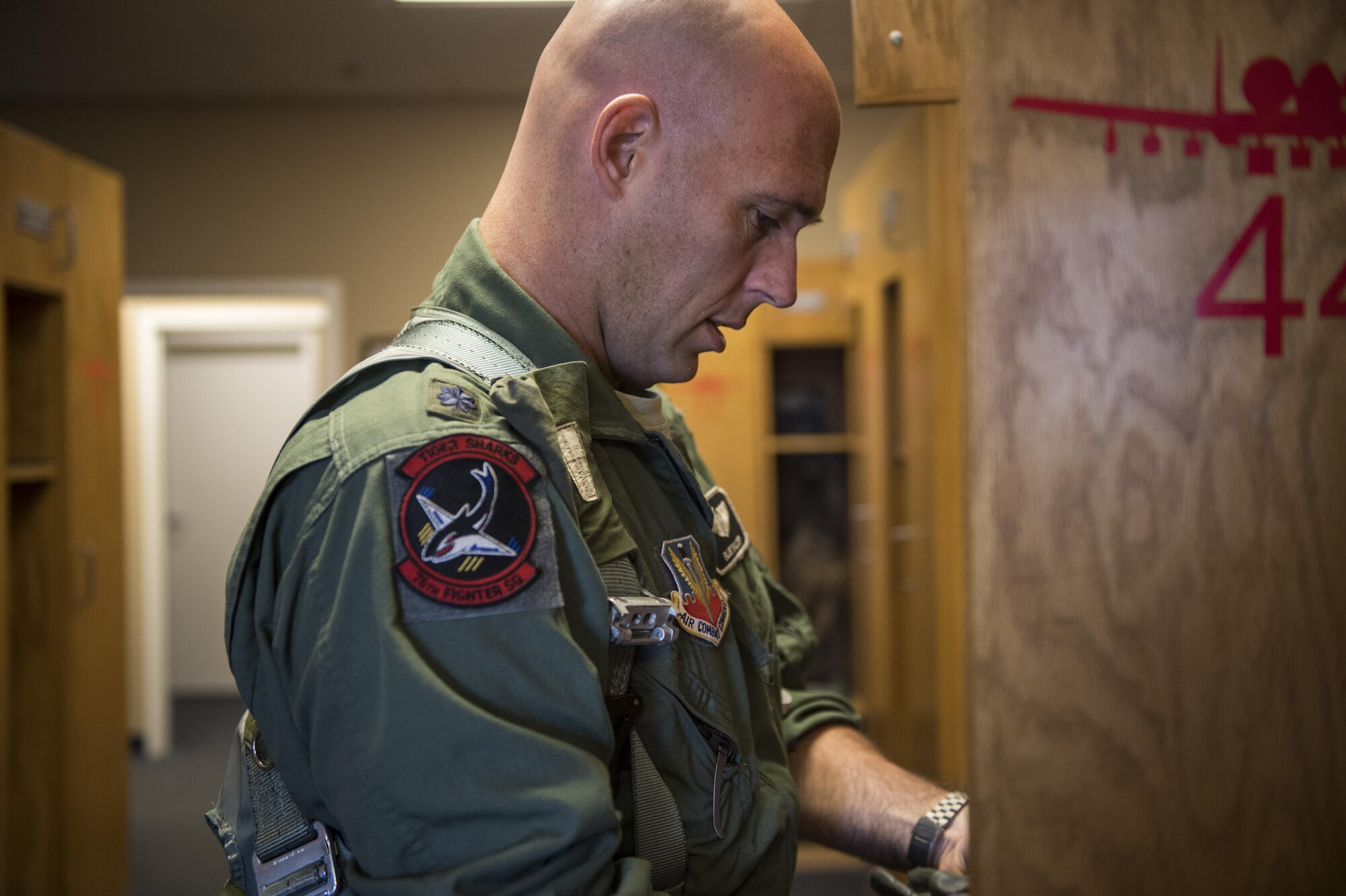 Lt. Col. Edward Balzer, 75th Fighter Squadron assistant director of operations, gathers his gear before departing for a flight, Oct. 31, 2017, at Moody Air Force Base, Ga. Pilots, traveled to Eglin AFB, Fla., to participate in exercise COMBAT HAMMER. The exercise evaluates the effectiveness, maintainability, suitability and accuracy of precision guided munitions and high technology air to ground munitions from tactical deliveries against realistic targets with realistic enemy defenses. Moody’s team will be assessed and trained on how accurately and quickly a munition is built, loaded onto the aircraft and dropped from the aircraft onto a target. (U.S. Air Force photo by Senior Airman Janiqua P. Robinson)