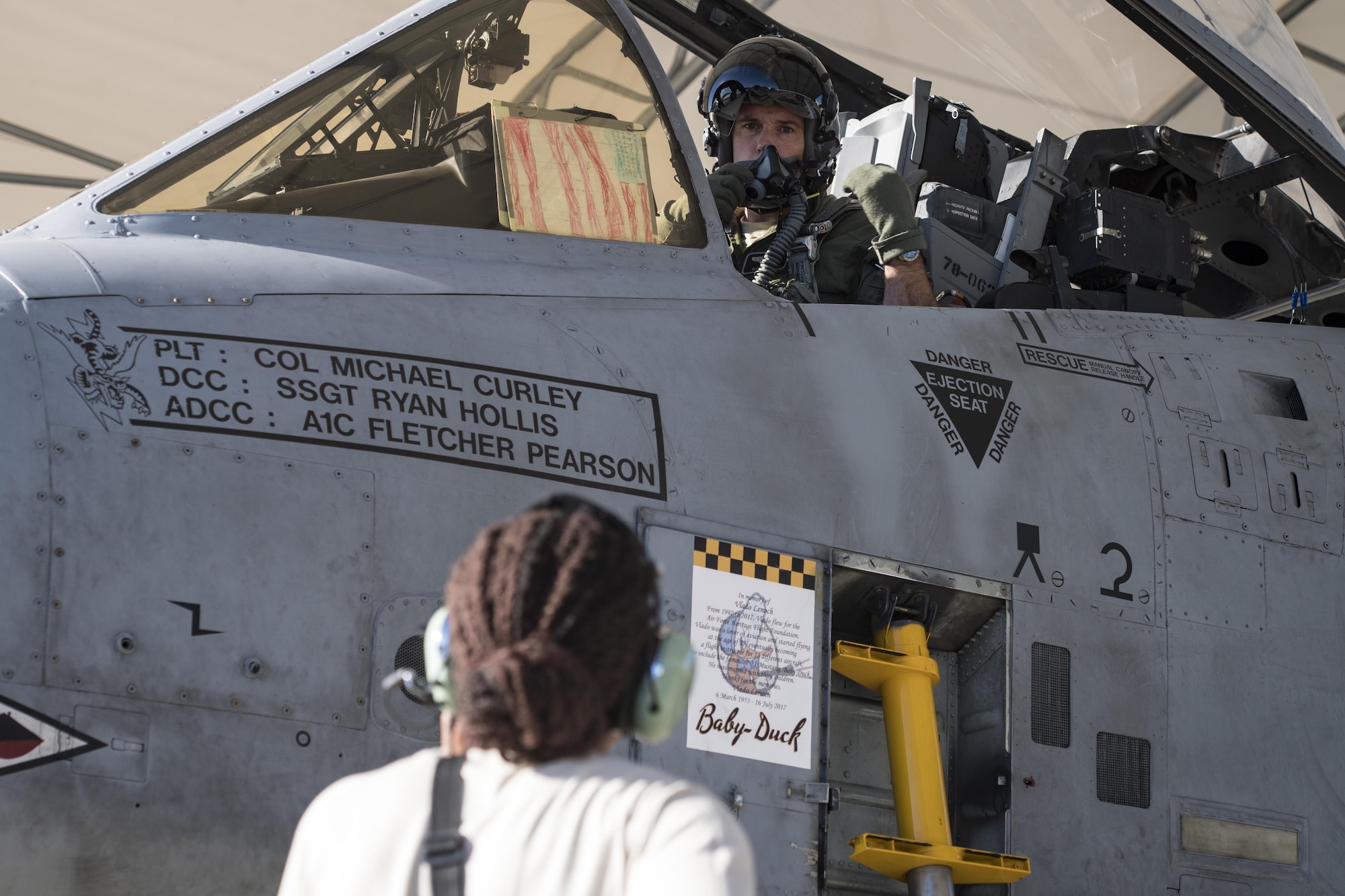 Lt. Col. Edward Balzer, 75th Fighter Squadron assistant director of operations, talks with Airman 1st Class Tori Payne, 74th Aircraft Maintenance Unit crew chief prior to takeoff, Oct. 31, 2017, at Moody Air Force Base, Ga. Pilots, traveled to Eglin AFB, Fla., to participate in exercise COMBAT HAMMER. The exercise evaluates the effectiveness, maintainability, suitability and accuracy of precision guided munitions and high technology air to ground munitions from tactical deliveries against realistic targets with realistic enemy defenses. Moody’s team will be assessed and trained on how accurately and quickly a munition is built, loaded onto the aircraft and dropped from the aircraft onto a target. (U.S. Air Force photo by Senior Airman Janiqua P. Robinson)