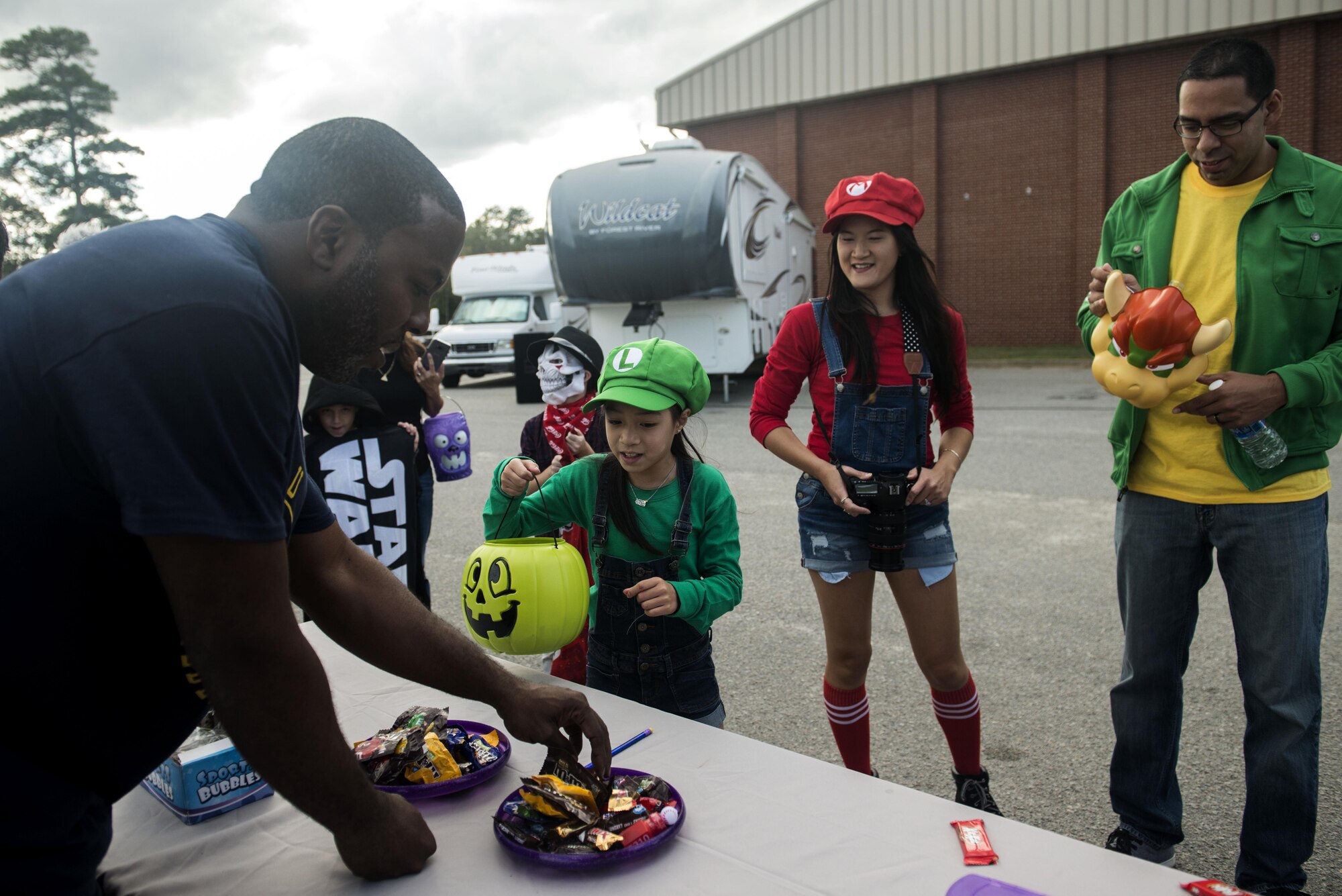 A Team Shaw family trick-or-treats at the ninth annual Boo Bash at Shaw Air Force Base, South Carolina, Oct. 28, 2017.