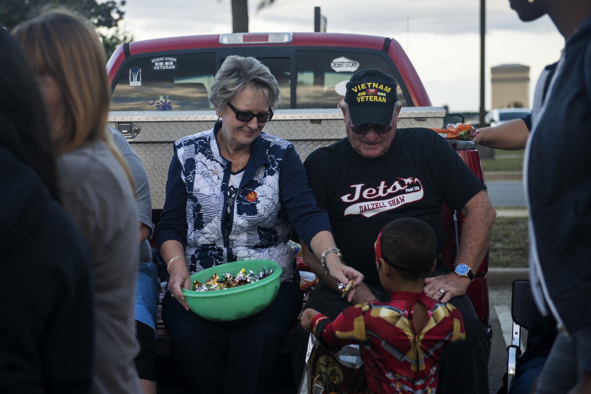 Team Shaw members hand out candy to children at Shaw Air Force Base, South Carolina, Oct. 28, 2017.