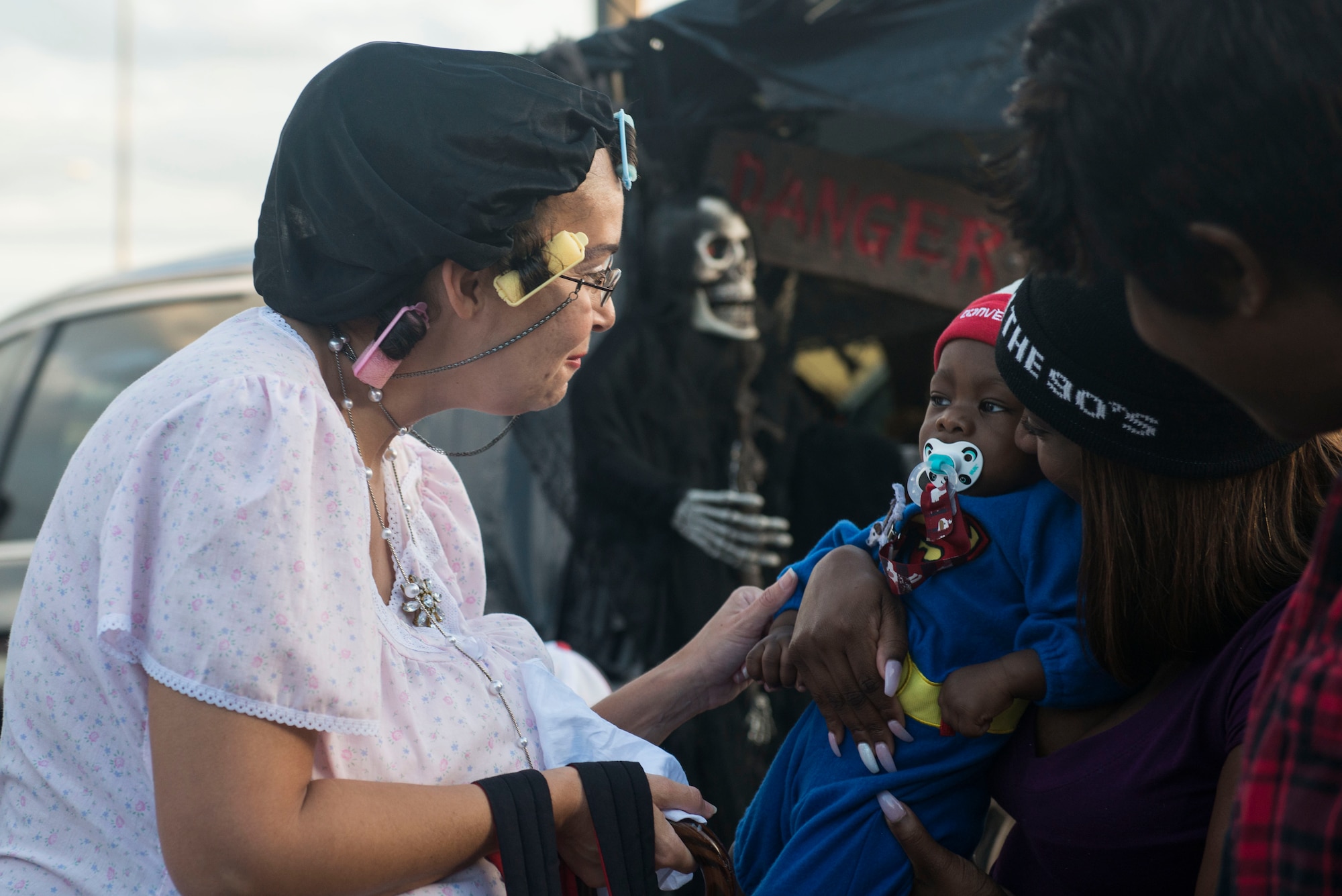 A Team Shaw member interacts with a child during the “trunk-or-treat” portion of the annual Boo Bash at Shaw Air Force Base, South Carolina, Oct. 28, 2017.