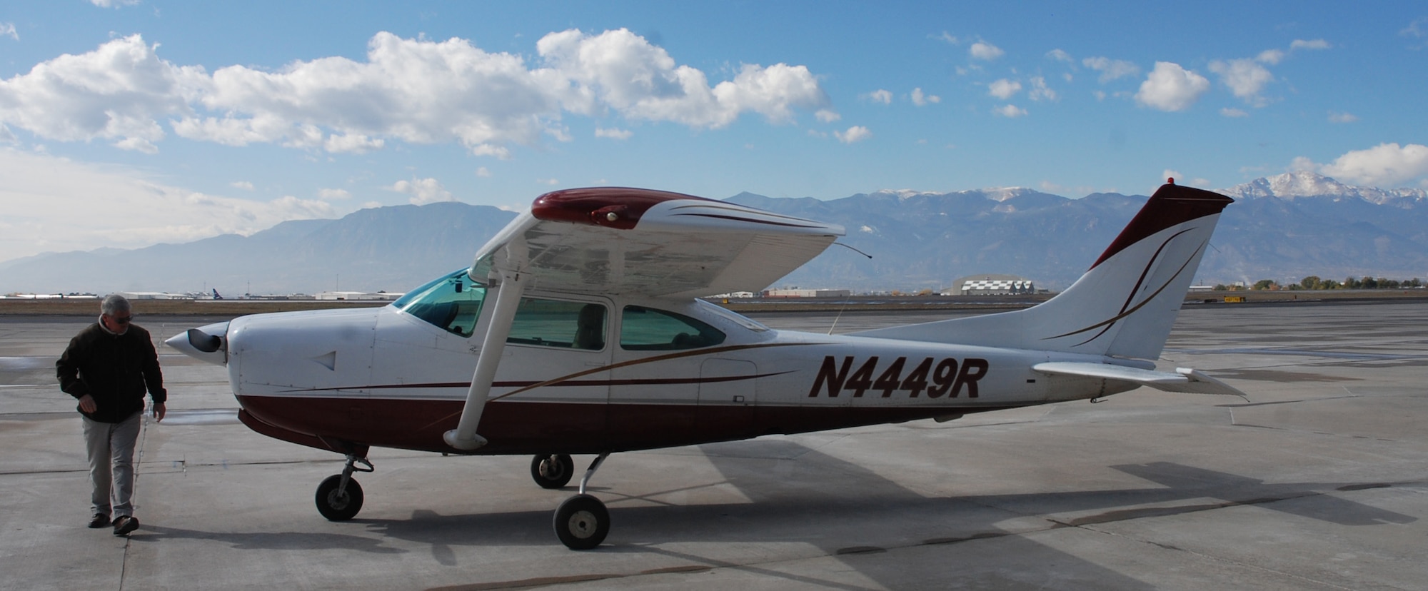 Greg Cortum, Peterson Air Force Base Aero Club/Rocky Mountain Flight Training Center manager, undertakes a preflight walk around at the club hangar on Peterson Air Force Base, Colorado on Oct. 31, 2017. The group was recognized as a 2017 Aircraft Owners and Pilots Association Training Experience Awards Distinguished Flight School. (U.S. Air Force photo by Dave Smith)