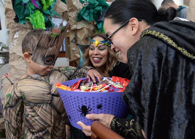 Staff Sgt. Yelena Scott from the 673d Medical Support Squadron trick-or-treat’s with her son Austyn, 3, at the annual 673d Medical Group Trick-or-treat event at Joint Base Elmendorf-Richardson, Alaska, Oct. 27, 2017. . During this event the hospital will transform the clinic lobbies into themed stages for costumed hospital staff to pass out candy to participants on Oct. 26, 2018.