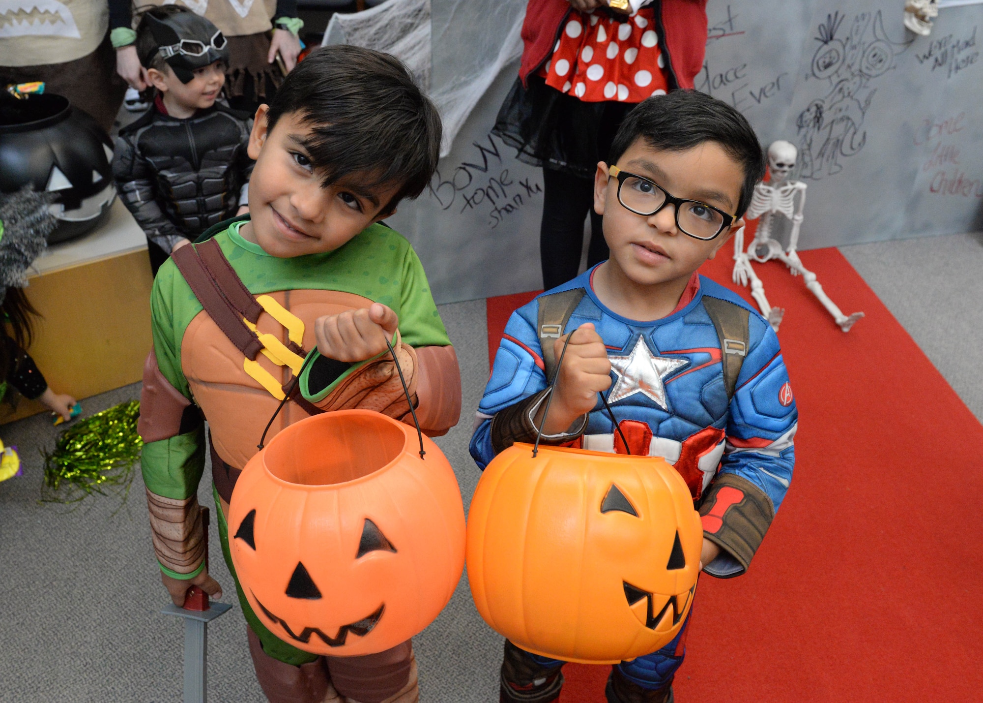 Rodrigo, 5, and Gustavo, 4, participate in the annual 673d Medical Group trick-or-treat event at the hospital on Joint Base Elmendorf-Richardson, Alaska, Oct. 27, 2017. Costumed JBER hospital workers with themes picked by their individual clinics will hand out candy to people of all ages during the annual event scheduled for Oct. 26, 2018.