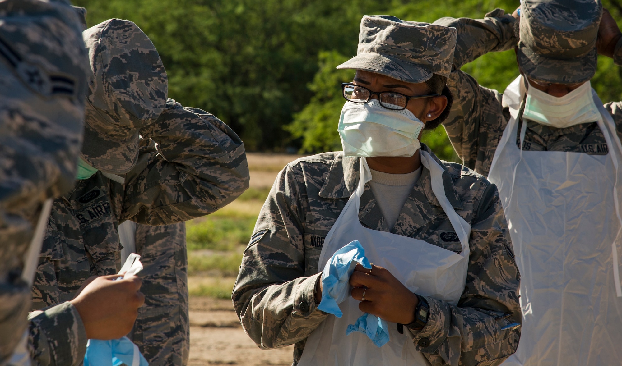 Airman 1st Class Asia Andrews, 647th Force Support Squadron search and recovery team member, dons her personal protective equipment during the search and recovery team’s training event on Joint Base Pearl Harbor-Hickam, Hawaii, Oct. 27, 2017. The search and recovery team is tasked with recovering human remains from accident sites. (U.S. Air Force photo by Tech. Sgt. Heather Redman)