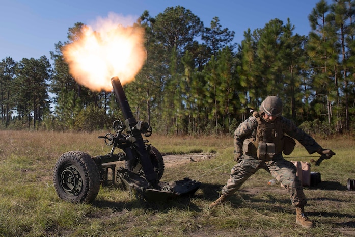 A Marine pulls a cord to fire a 120-mm mortar as part of Exercise Bold Alligator at Camp Lejeune, N.C. Oct. 23, 2017. Bold Alligator is designed to showcase the capabilities of the Navy-Marine Corps team, and demonstrate our cohesion with allied nations. The U.S. Marines and British troops gained camaraderie through integrated training, allowing them to familiarize themselves with each other’s capabilities. (U.S. Marine Corps Photo by Pfc. Nicholas Guevara)