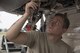 U.S. Air Force Airman 1st Class Tyler Bunn, performs a post-flight inspection in the nose landing gear of an F-16 Fighting Falcon at Misawa Air Base, Japan, Aug. 22, 2017. The program prepares maintenance Airmen for their 5-level upgrade and assist in career development course material, which is essential to providing quality maintenance performance on aircraft. (U.S. Air Force photo by Airman 1st Class Sadie Colbert)