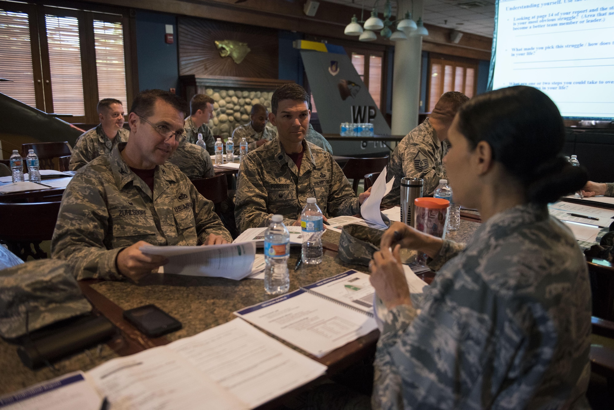 U.S. Air Force Col. Joann Palmer, 8th Medical Group commander, right, converses with Col. Michael Zuhlsdorf, 8th Mission Support Group commander, and Lt. Col. Roberts, 8th Mission Support Group deputy commander, during the Leadership Behavior DNA workshop at Kunsan Air Base, Republic of Korea, Sep. 1, 2017. The workshop, hosted by The Profession of Arms Center of Excellence, allowed participants to learn about the different traits and factors involved with interpersonal communications and leadership decision-making. (U.S. Air Force photo by Senior Airman Michael Hunsaker)