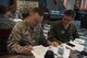 U.S. Air Force MSgt. Michael Shain, 8th Fighter Wing administrative superintendent, and Col. Steven Tittel, 8th Fighter Wing vice commander, compare charts during the Leadership Behavior DNA workshop at Kunsan Air Base, Republic of Korea, Sep. 1, 2017. Throughout the workshop, hosted by PACE, leadership from different organizations around Kunsan learned how to better themselves as leaders by gaining a better understanding of varying factors and traits involved with interpersonal communications and leadership decision-making. (U.S. Air Force photo by Senior Airman Michael Hunsaker)