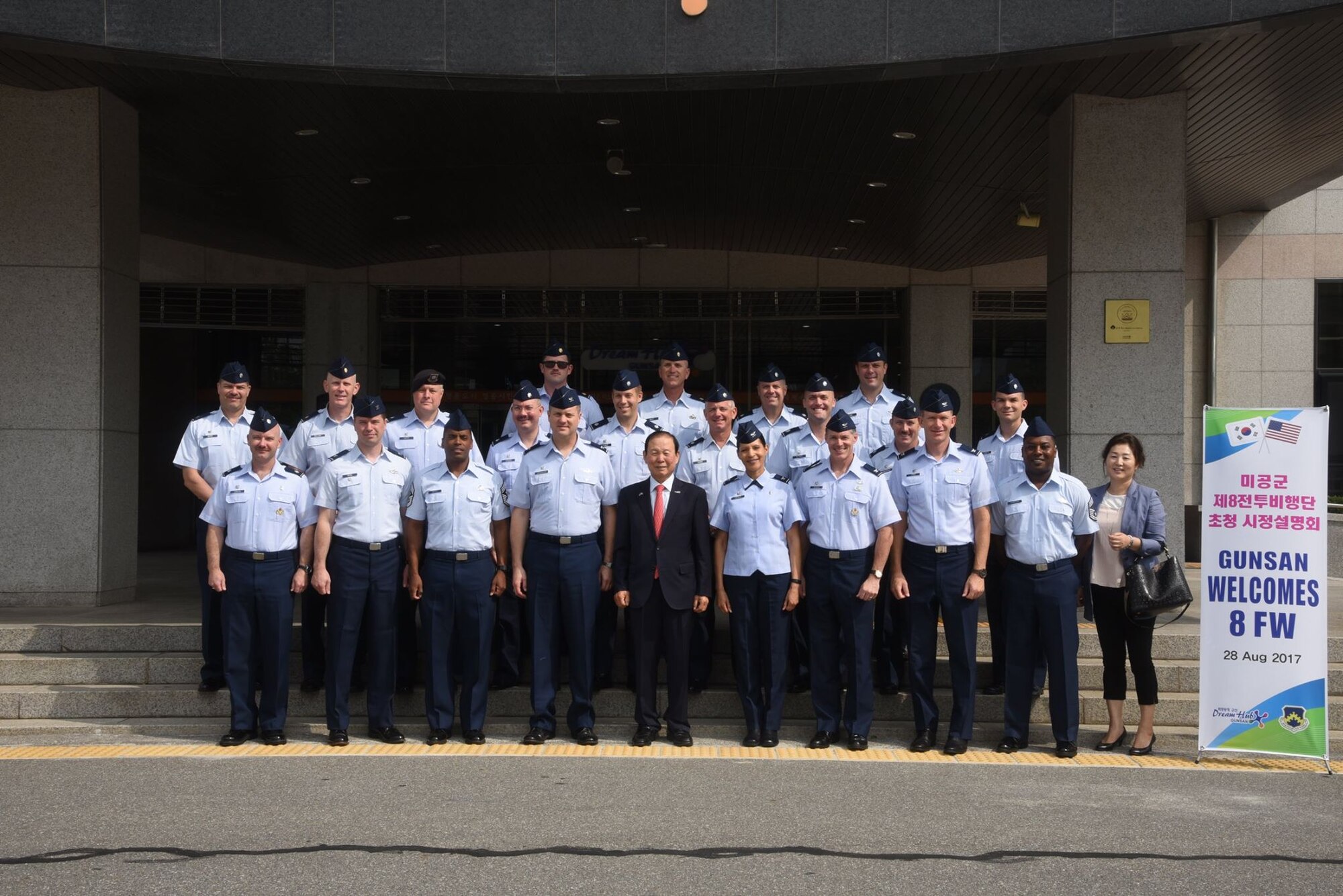 U.S. Air Force Airmen assigned to Kunsan Air Base, Republic of Korea, pose with Mayor Moon Dong-shin, Gunsan City Mayor, during an immersion tour in Gunsan City, ROK, Aug. 28, 2017. During the tour Airman ate a traditional bibimbap meal and experienced the history and heritage of South Korea at the Gunsan Modern History Museum. (U.S. Air Force photo by 2nd Lt. Brittany Curry)