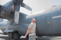Master Sgt. Norbert Feist, 386th Expeditionary Aircraft Maintenance Squadron crew chef conducts a pre-flight safety inspection on aircraft 1004 Wednesday, August 30th, at an undisclosed location in Southwest Asia. Feist has been the dedicated crew chief for aircraft 1004 for 21 years. (U.S. Air Force photo by Master Sgt. Eric M. Sharman)