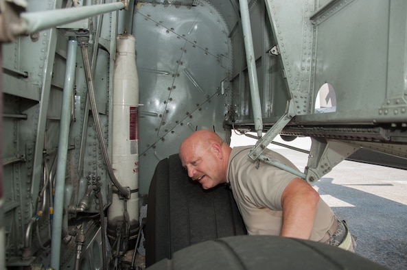 Master Sgt. Norbert Feist, 386th Expeditionary Aircraft Maintenance Squadron crew chef inspects the right wheel well on aircraft 1004 Wednesday, August 30th, at an undisclosed location in Southwest Asia. Feist has been the dedicated crew chief for aircraft 1004 for 21 years. (U.S. Air Force photo by Master Sgt. Eric M. Sharman)