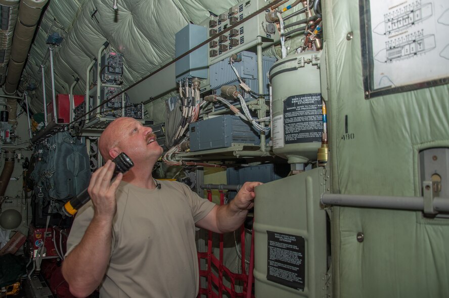 Master Sgt. Norbert Feist, 386th Expeditionary Aircraft Maintenance Squadron crew chef checks for any hydraulic leaks on aircraft 1004 Wednesday, August 30th, at an undisclosed location in Southwest Asia. Feist has been the dedicated crew chief for aircraft 1004 for 21 years. (U.S. Air Force photo by Master Sgt. Eric M. Sharman)