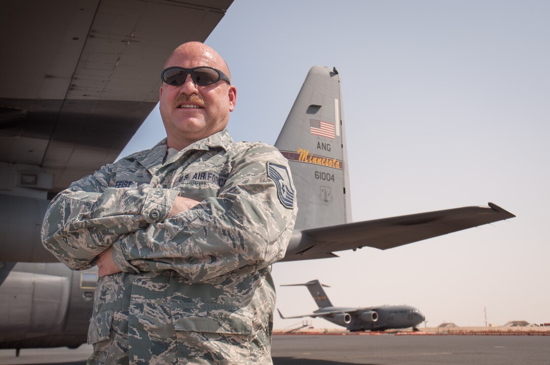 Master Sgt. Norbert Feist, 386th Expeditionary Aircraft Maintenance Squadron crew chef poses for a photograph alongside aircraft 1004 Wednesday, August 30th, at an undisclosed location in Southwest Asia. Feist has been the dedicated crew chief for aircraft 1004 for 21 years. (U.S. Air Force photo by Master Sgt. Eric M. Sharman)