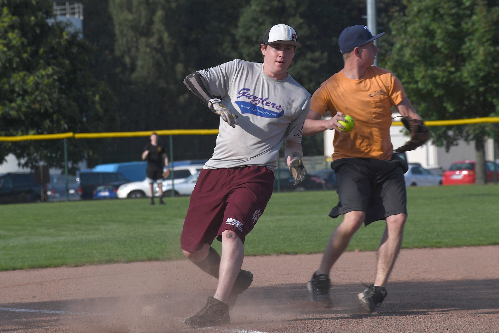 Kodie Bellew, 86th Maintenance Squadron softball player, makes it safely on a base during an intramural softball game Aug. 22, 2017, on Ramstein Air Base, Germany. Bellew played on the team as a dependent because his father works for the 86th MXS. (U.S. Air Force photo by Staff Sgt. Nesha Humes Stanton)