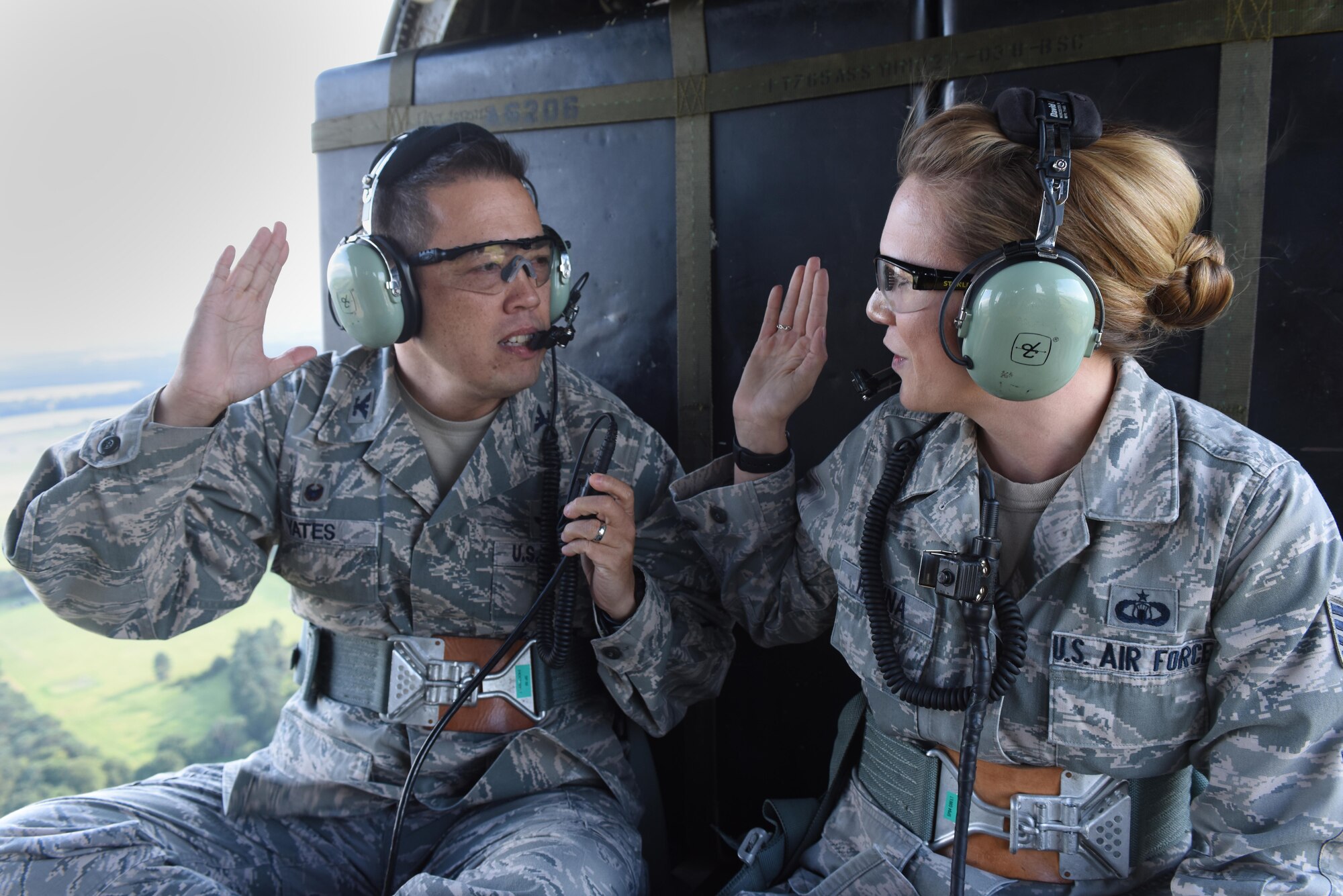 Col. Donn Yates, 48th Operations Group commander, reenlists an Airman assigned to the 48th Operation Support Squadron in a HH-60G Pave Hawk assigned to the 56th Rescue Squadron flying over Royal Air Force Lakenheath, England, August 31. The 48th OG consists of two F-15E Strike Eagle squadrons, an F-15C Eagle Squadron and two rescue squadrons. (U.S. Air Force photo/Airman 1st Class Eli Chevalier)