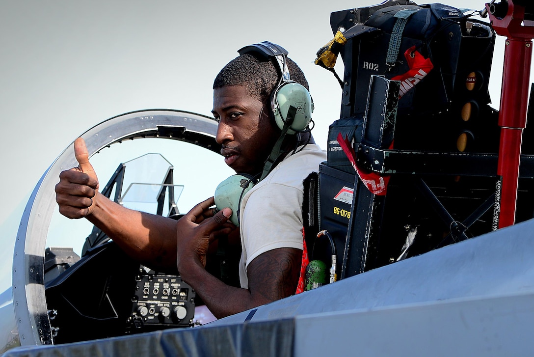 An Airman from the 493rd Expeditionary Fighter Squadron aircraft maintenance unit signals to his team that an F-15C systems check is complete at Siauliai Air Base, Lithuania, Aug. 31, 2017. The 439rd EFS AMU ensures that all aircraft are ready at a moments notice to meet the needs of the NATO Baltic Air Police mission. (U.S. Air Force photo/ Tech. Sgt. Matthew Plew)