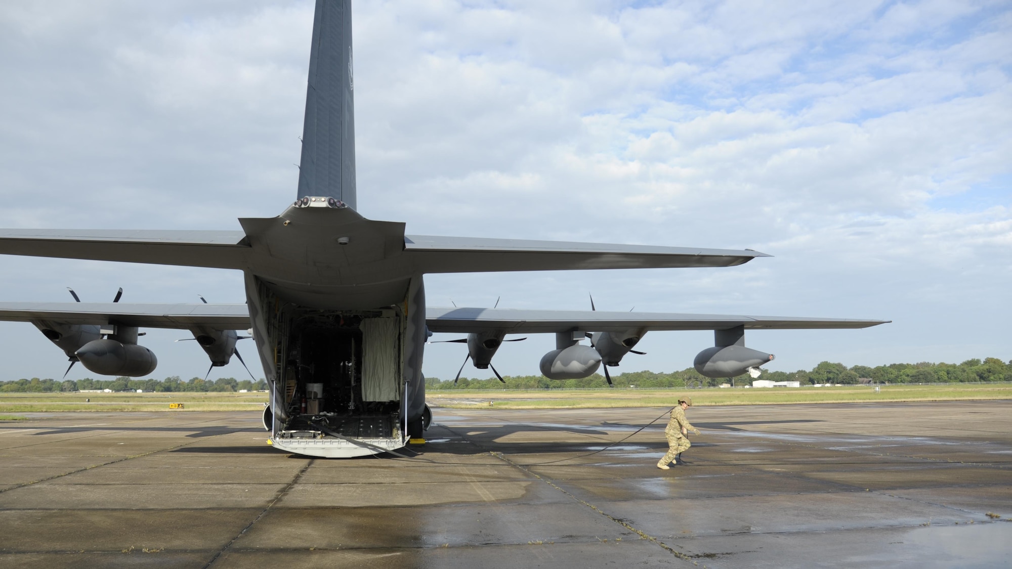 U.S. Air Force Tech. Sgt. Shayna Jacoby, 23d Logistics Readiness Squadron, stretches a 300 foot fuel line from a HC-130J Combat King II Aug. 31, 2017, to prepare a forward area refueling point (FARP) at Jack Brooks Regional Airport in Beaumont, Texas.