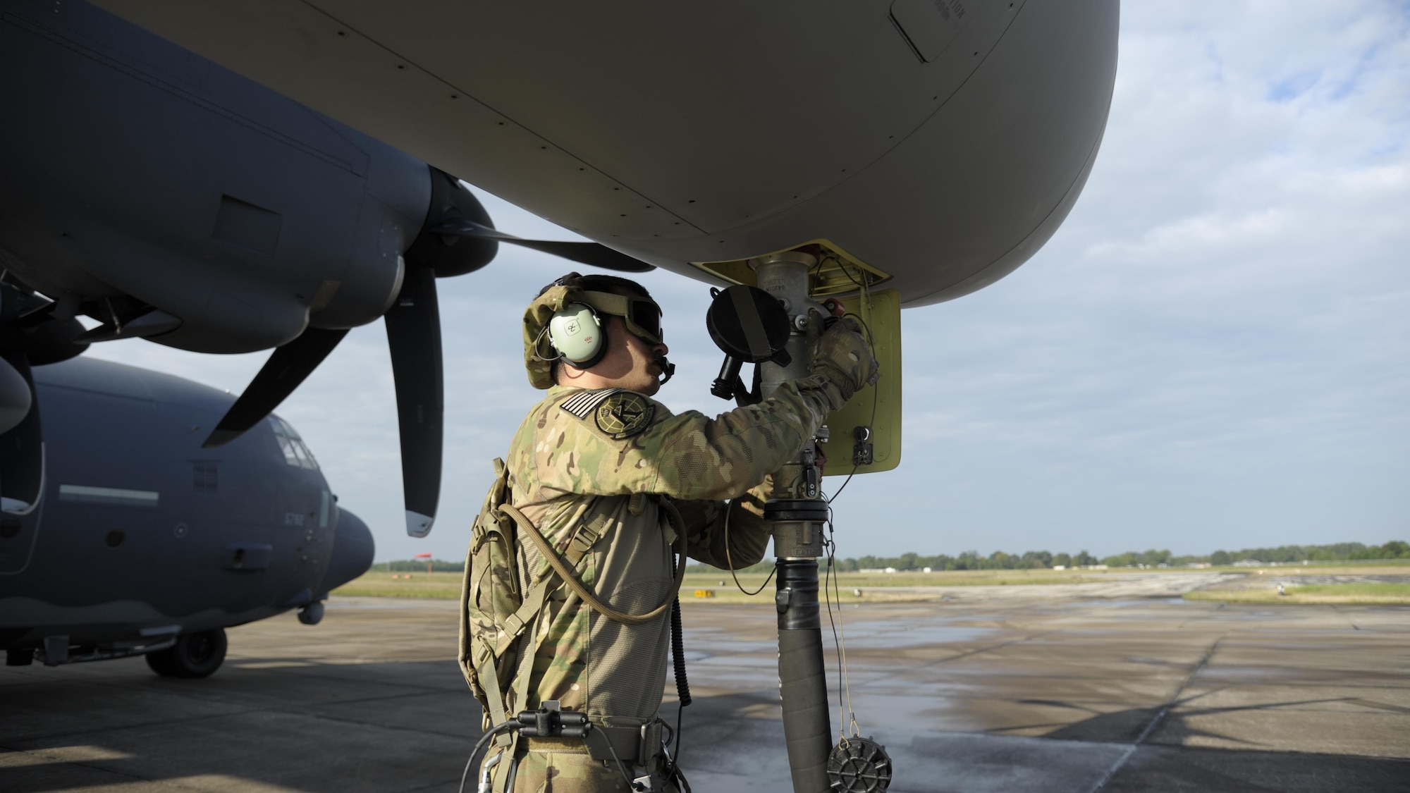 Airman 1st Class Nicholas Maycumber, 71st Rescue Squadron, prepares a HC-130J Combat King II Aug. 31, 2017, to deliver fuel at a forward area refueling point (FARP) at Jack Brooks Regional Airport in Beaumont, Texas.