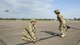 U.S. Air Force Staff Sgt. John San Inocencio, 23d Logistics Readiness Squadron, holds onto a fuel line hose as Tech. Sgt. Shayna Jacoby, 23d Logistics Readiness Squadron, squeegees the hose to remove the remaining fuel following a refuel Aug. 31, 2017, at Jack Brooks Regional Airport in Beaumont, Texas.