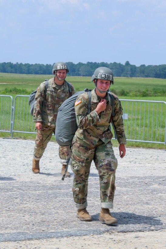 Cadet Meghan Copenhaver, a trainee at the U.S. Army Airborne School assigned to Alpha Company, 1st Battalion, 507th Parachute Infantry Regiment, returns from her first jump at Fryar Drop Zone at Fort Benning, Ga., Aug. 14, 2017. Copenhaver is the first fourth-generation Army paratrooper. Army photo by Markeith Horace