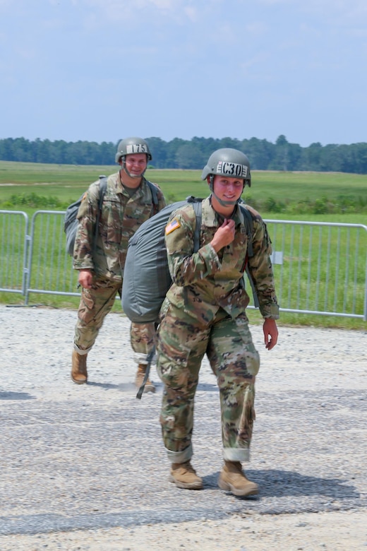 Cadet Meghan Copenhaver, a trainee at the U.S. Army Airborne School assigned to Alpha Company, 1st Battalion, 507th Parachute Infantry Regiment, returns from her first jump at Fryar Drop Zone at Fort Benning, Ga., Aug. 14, 2017. Copenhaver is the first fourth-generation Army paratrooper. Army photo by Markeith Horace