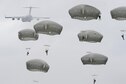 Paratroopers assigned to the 4th Infantry Brigade Combat Team (Airborne), 25th Infantry Division, U.S. Army Alaska, descend after jumping from a C-17 Globemaster III out of Joint Base Charleston, S.C., while conducting airborne training over Malemute drop zone, JB Elmendorf-Richardson, Alaska, Aug. 24, 2017. The Soldiers of 4/25 recently completed a series of jumps to ensure they maintain their airborne qualifications. (U.S. Air Force photo/Alejandro Peña)