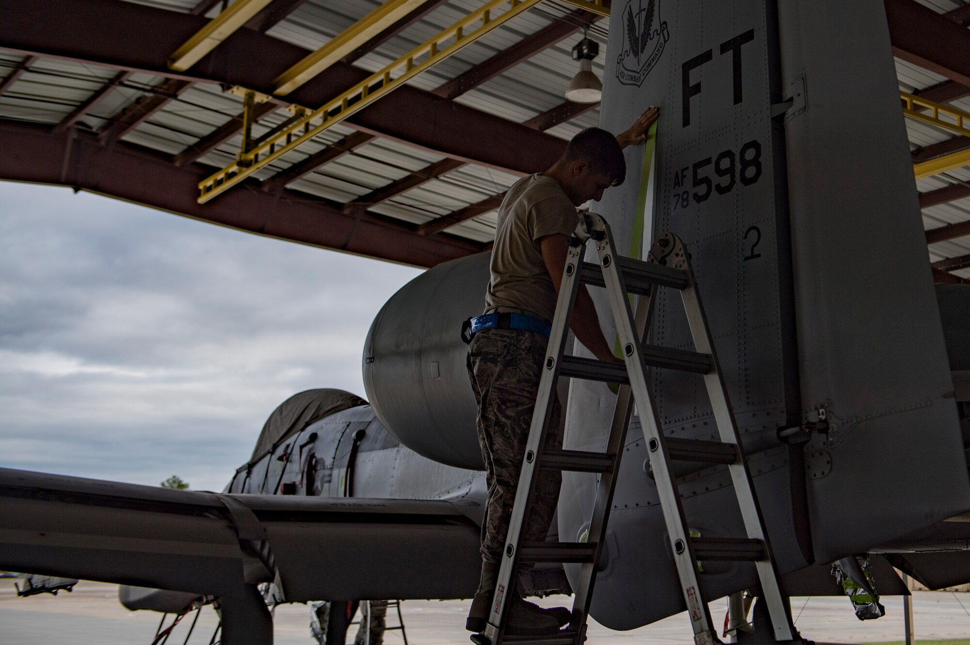 Airman 1st Class Jake Dromgold, 23d Aircraft Maintenance Squadron 74th Aircraft Maintenance Unit crew chief, prepares an A-10C Thunderbolt II to be washed, Aug. 28, 2017, at Moody Air Force Base, Ga. Maintenance procedures require that A-10s are washed at least every 180 days to prevent maintenance issues and safety hazards to the pilot. Since strong chemicals are used to clean the aircraft Airmen must wear personal protective equipment. (U.S. Air Force photo by Airman 1st Class Daniel Snider)