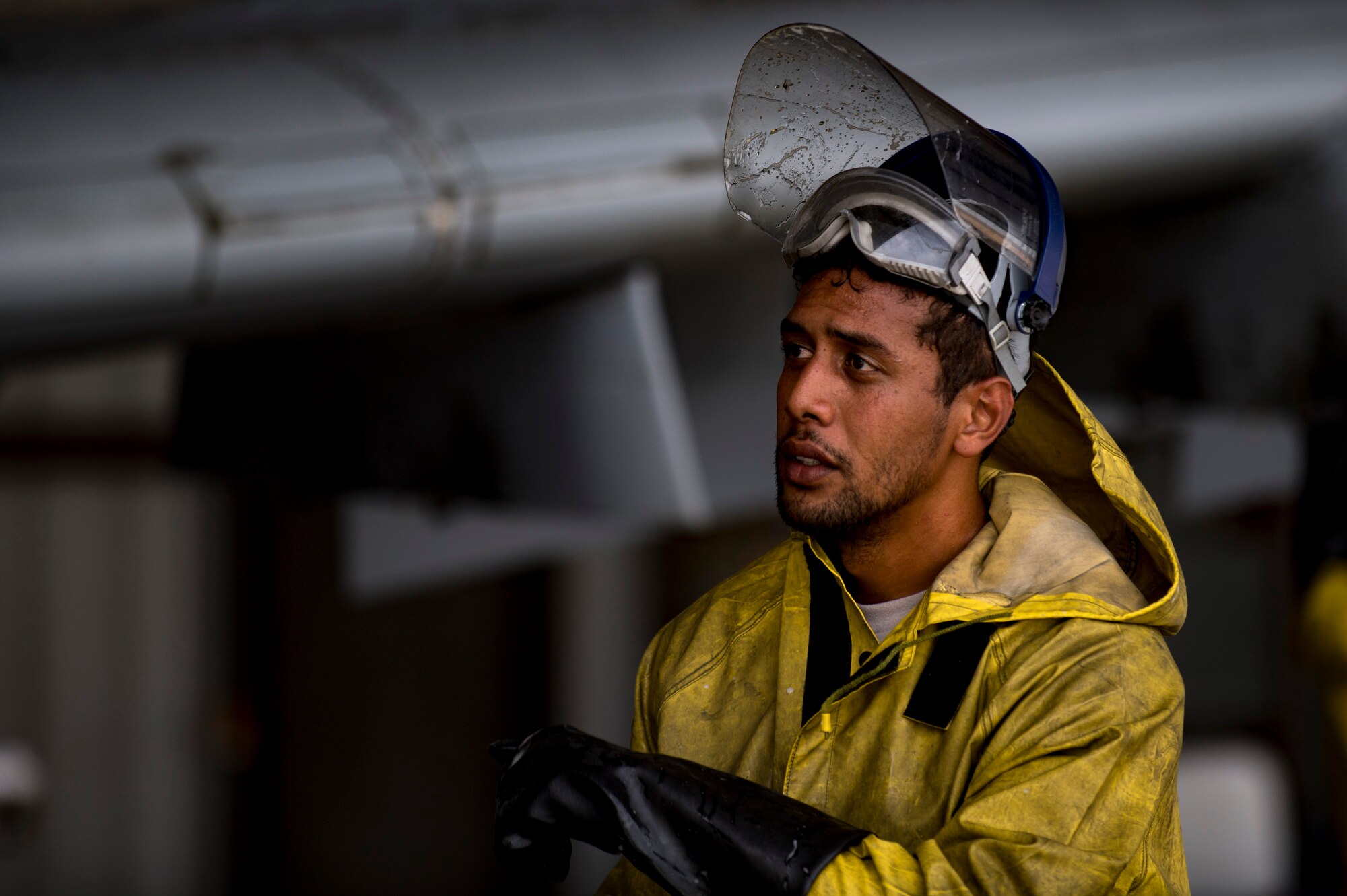 Senior Airman Daniel Ioane, 23d Aircraft Maintenance Squadron 75th Aircraft Maintenance Unit crew chief, inspects a washed portion of an A-10C Thunderbolt II, Aug. 28, 2017, at Moody Air Force Base, Ga. Maintenance procedures require that A-10s are washed at least every 180 days to prevent maintenance issues and safety hazards to the pilot. Since strong chemicals are used to clean the aircraft Airmen must wear personal protective equipment. (U.S. Air Force photo by Airman 1st Class Daniel Snider)