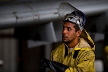 Senior Airman Daniel Ioane, 23d Aircraft Maintenance Squadron 75th Aircraft Maintenance Unit crew chief, inspects a washed portion of an A-10C Thunderbolt II, Aug. 28, 2017, at Moody Air Force Base, Ga. Maintenance procedures require that A-10s are washed at least every 180 days to prevent maintenance issues and safety hazards to the pilot. Since strong chemicals are used to clean the aircraft Airmen must wear personal protective equipment. (U.S. Air Force photo by Airman 1st Class Daniel Snider)