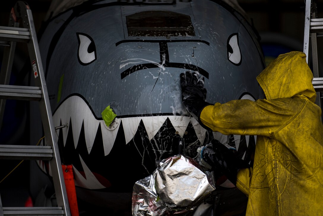 A Member of the 23d Aircraft Maintenance Squadron cleans the nose of an A-10C Thunderbolt II, Aug. 28, 2017, at Moody Air Force Base, Ga. Maintenance procedures require that A-10s are washed at least every 180 days to prevent maintenance issues and safety hazards to the pilot. Since strong chemicals are used to clean the aircraft Airmen must wear personal protective equipment. (U.S. Air Force photo by Airman 1st Class Daniel Snider)