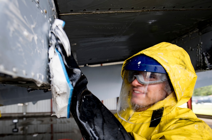 Airman 1st Class Jake Dromgold, 23d Aircraft Maintenance Squadron 74th Aircraft Maintenance Unit crew chief, washes under the wing of an A-10C Thunderbolt II, Aug. 28, 2017, at Moody Air Force Base, Ga. Maintenance procedures require that A-10s are washed at least every 180 days to prevent maintenance issues and safety hazards to the pilot. Since strong chemicals are used to clean the aircraft Airmen must wear personal protective equipment. (U.S. Air Force photo by Airman 1st Class Daniel Snider)