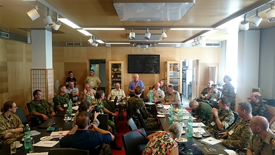 Maj. Gen. (retired) Evan L. “Curly” Hultman, former President of CIOR (1992-1994) and Honorary President of CIOR for Life, with members of the CIOR Council, addresses a packed room of CIMEX participants at the end of the three day long exercise. (Photo by Capt Jacques de Vries, South African Army Reserve Force.