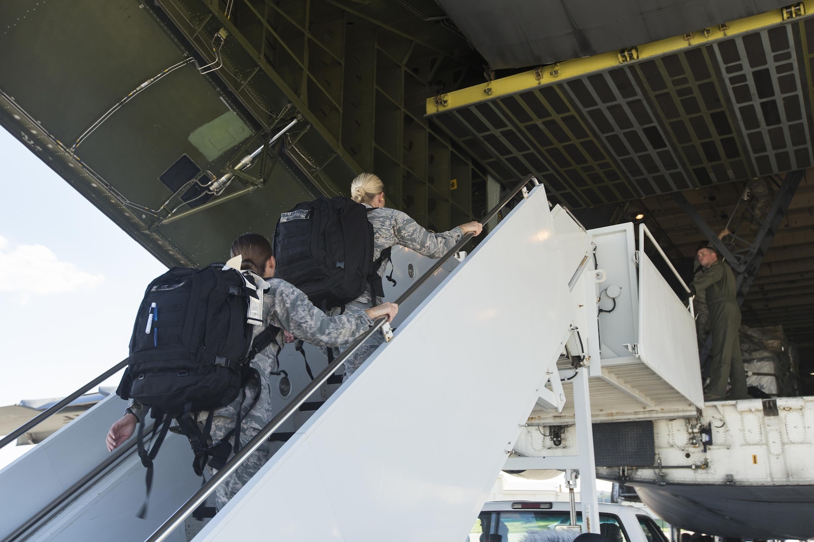 U.S. Air Force medical personnel board a military aircraft