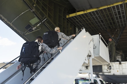 U.S. Air Force medical personnel board a military aircraft