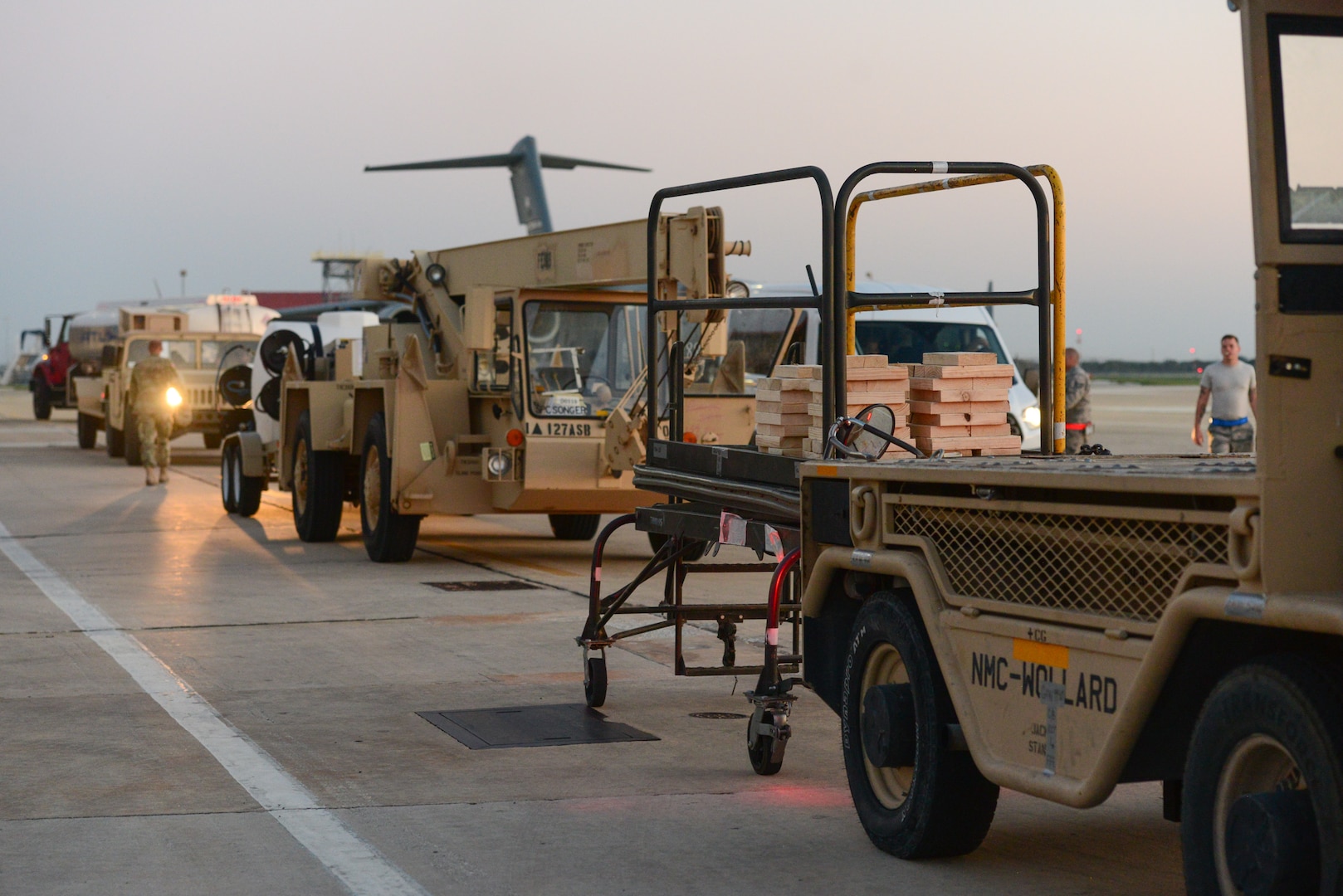 Members from the 502nd Logistics Readiness Squadron, the 433rd Airlift Wing, and the 445th Airlift Wing unload pallets and rolling stock containing maintenance equipment Aug. 30, 2017 at Joint Base San Antonio-Lackland Kelly Field, Texas.