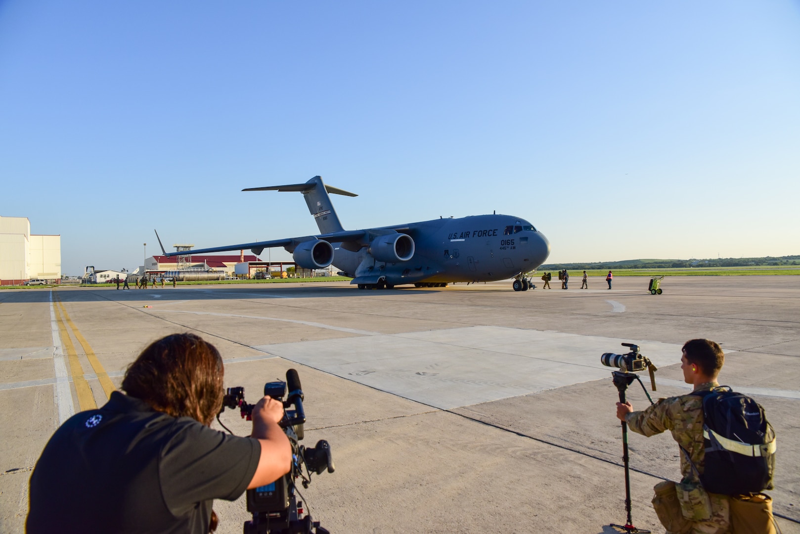 Members from the 502nd Logistics Readiness Squadron, the 433rd Airlift Wing, and the 445th Airlift Wing unload pallets and rolling stock containing maintenance equipment Aug. 30, 2017 at Joint Base San Antonio-Lackland Kelly Field, Texas.