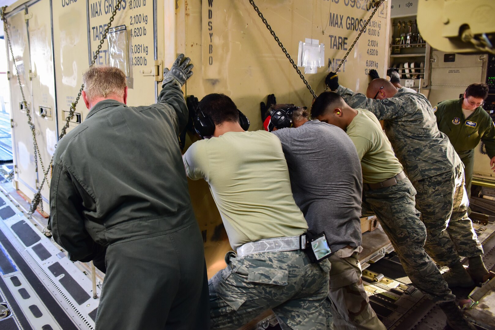 Members from the 502nd Logistics Readiness Squadron, the 433rd Airlift Wing, and the 445th Airlift Wing unload pallets and rolling stock containing maintenance equipment Aug. 30, 2017 at Joint Base San Antonio-Lackland Kelly Field, Texas.