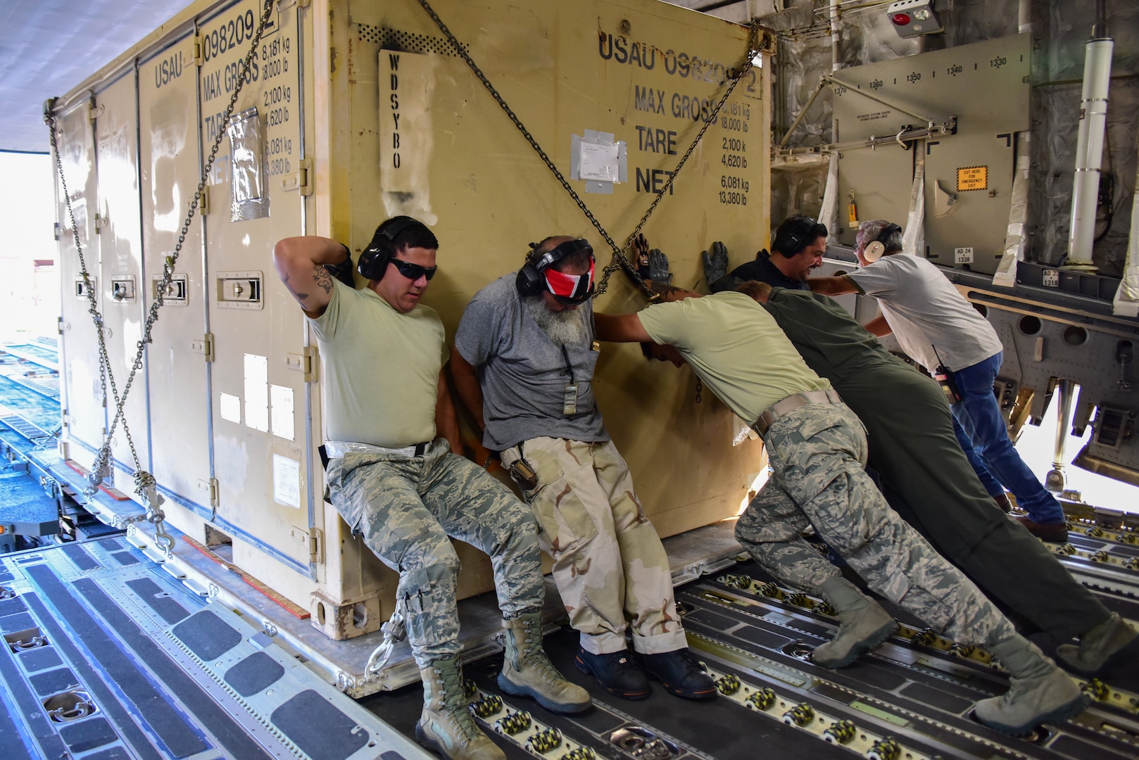 Members from the 502nd Logistics Readiness Squadron, the 433rd Airlift Wing, and the 445th Airlift Wing unload pallets and rolling stock containing maintenance equipment Aug. 30, 2017 at Joint Base San Antonio-Lackland Kelly Field, Texas.