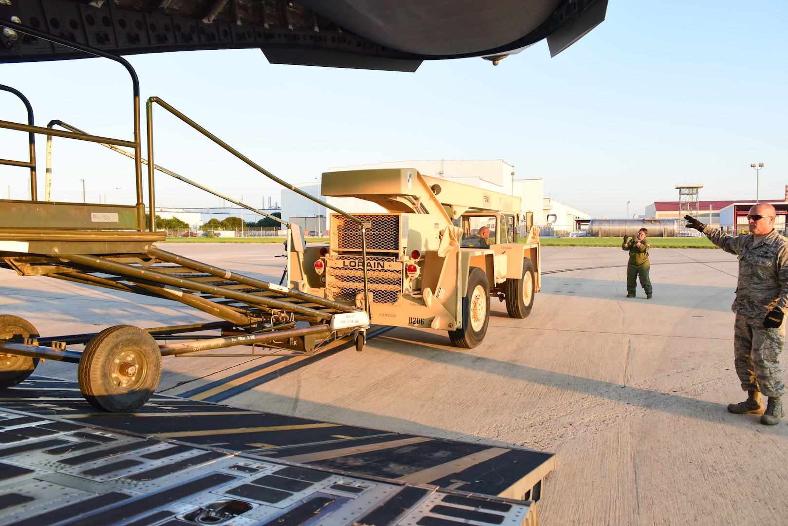 Members from the 502nd Logistics Readiness Squadron, the 433rd Airlift Wing, and the 445th Airlift Wing unload pallets and rolling stock containing maintenance equipment Aug. 30, 2017 at Joint Base San Antonio-Lackland Kelly Field, Texas.