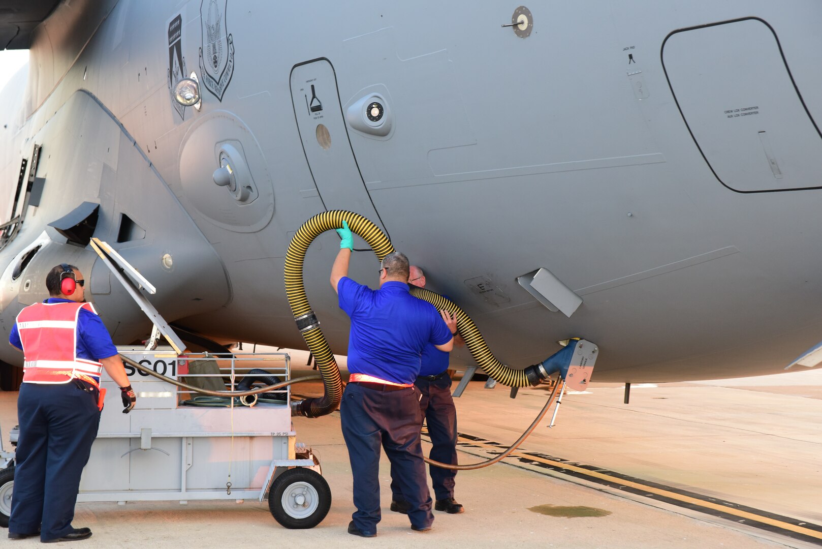 Members from the 502nd Logistics Readiness Squadron, the 433rd Airlift Wing, and the 445th Airlift Wing unload pallets and rolling stock containing maintenance equipment Aug. 30, 2017 at Joint Base San Antonio-Lackland Kelly Field, Texas.