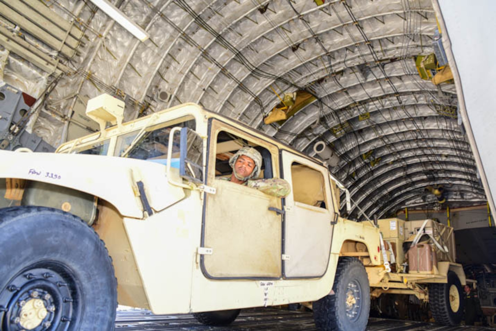 Soldiers from the 63rd Expeditionary Signal Battalion arrive with vehicles & equipment