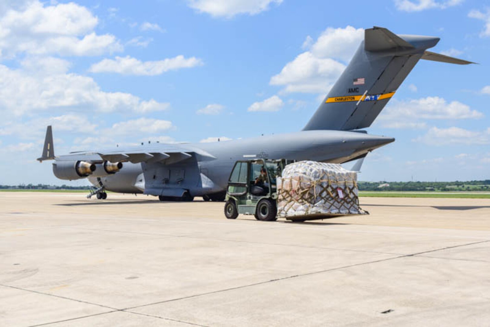 502D Logistical Readiness Squadron load a Lockheed C-130 Hercules on the flightline