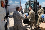 Joint Base San Antonio's unique joint partnership was on full display Aug. 29 at Joint Base San Antonio-Kelly Field Annex as Airmen from the 502nd Air Base Wing and Soldiers from the Texas Air National Guard loaded supplies and equipment to be sent in support of Hurricane Harvey relief efforts. Soldiers from U.S. Army North are in the Houston area to aid communications support and the search and recovery missions.