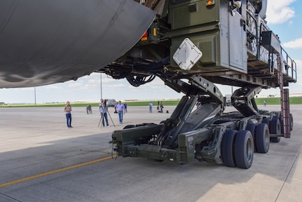 Members from the 502nd Logistics Readiness Squadron and the 433rd Airlift Wing load pallets containing medical supplies and equipment