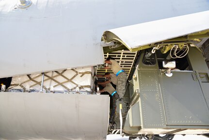 Members from the 502nd Logistics Readiness Squadron and the 433rd Airlift Wing load pallets containing medical supplies and equipment