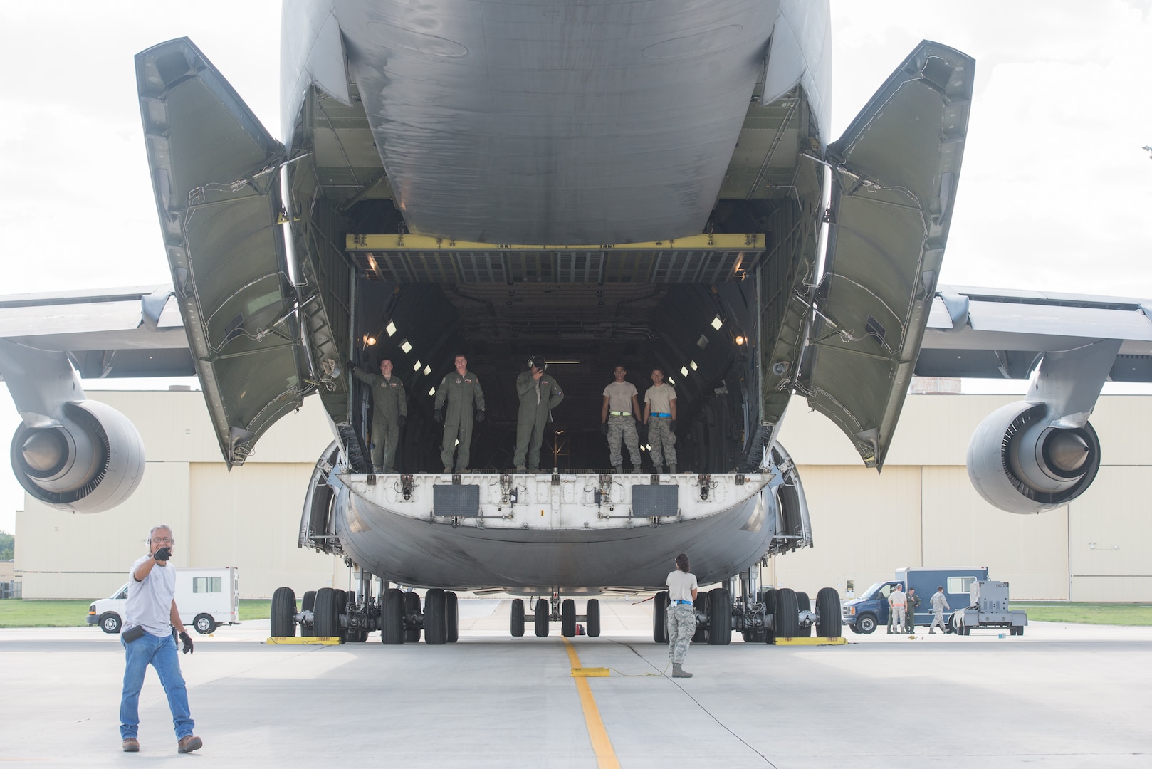 Members from the 502nd Logistics Readiness Squadron and the 433rd Airlift Wing load pallets containing medical supplies and equipment