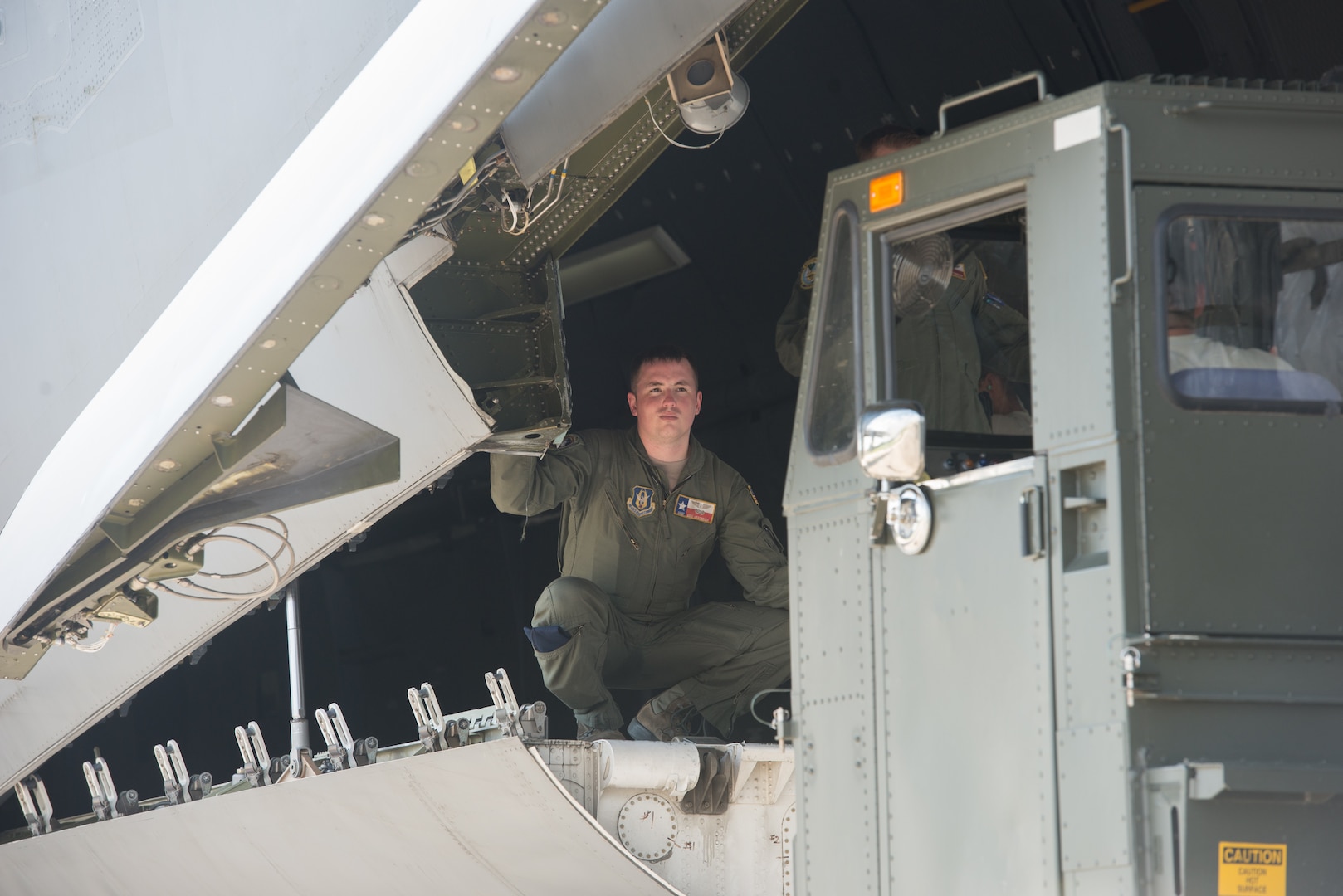 Members from the 502nd Logistics Readiness Squadron and the 433rd Airlift Wing load pallets containing medical supplies and equipment