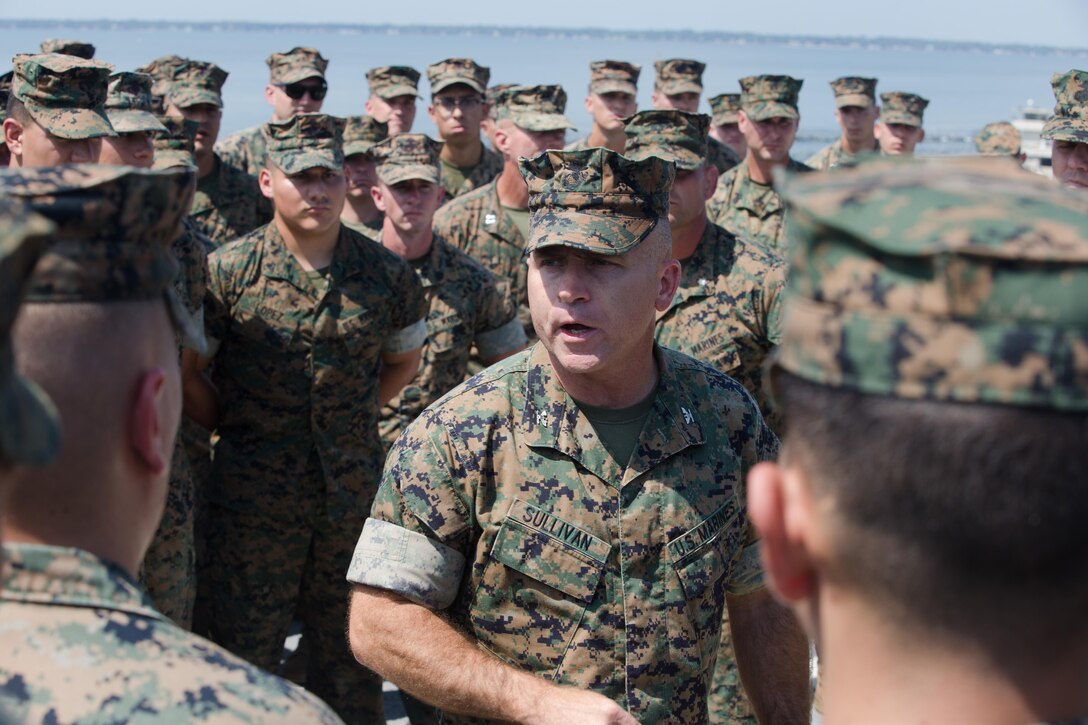 U.S. Marine Corps Col. Farrell J. Sullivan, commanding officer, 26th Marine Expeditionary Unit (MEU), addresses Marines before going underway aboard the USS Kearsarge at Naval Station Norfolk, Va., Aug. 31, 2017. Approximately 690 Marines from the 26th MEU, II Marine Expeditionary Force, embarked aboard the USS Kearsarge (LHD 3) as part of prudent preparatory measures in anticipation of future tasking to support relief efforts in the aftermath of Hurricane Harvey. (U.S. Marine Corps photo by Lance Cpl. Alexis C. Schneider)